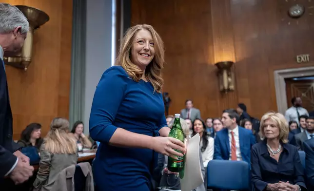 Wellness influencer and entrepreneur Dr. Casey Means takes her seat before the Senate health committee as she seeks approval to be U.S. surgeon general, at the Capitol in Washington, Wednesday, Feb. 25, 2026. (AP Photo/J. Scott Applewhite)