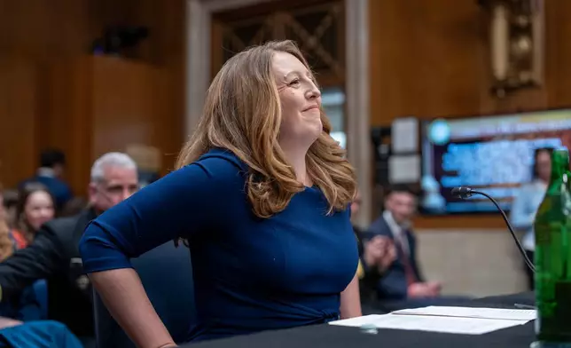 Wellness influencer and entrepreneur Dr. Casey Means takes her seat before the Senate health committee as she seeks approval to be U.S. surgeon general, at the Capitol in Washington, Wednesday, Feb. 25, 2026. (AP Photo/J. Scott Applewhite)