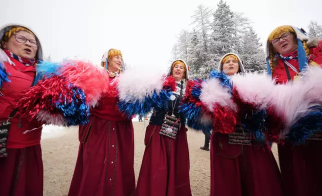 Biathlon fans cheer ahead of the men's 4x7.5-kilometer relay race at the 2026 Winter Olympics in Anterselva, Italy, Tuesday, Feb. 17, 2026. (AP Photo/Andrew Medichini)