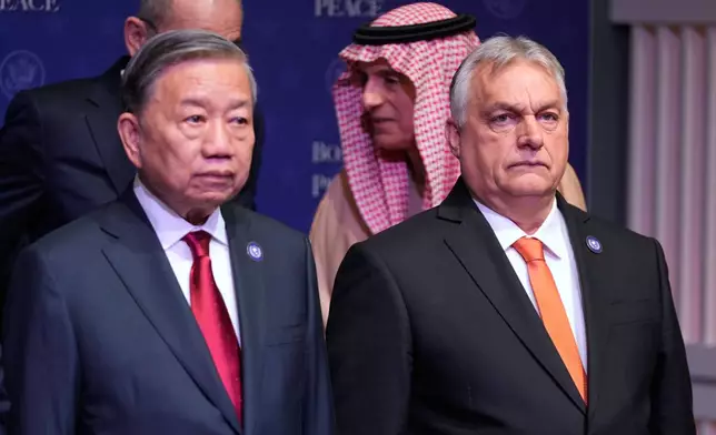 Vietnam's Communist Party General Secretary To Lam, left and Hungarian Prime Minister Viktor Orban, during a Board of Peace meeting at the U.S. Institute of Peace, Thursday, Feb. 19, 2026, in Washington. (AP Photo/Mark Schiefelbein)