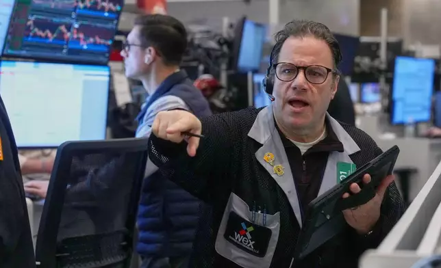Options trader Anthony Spina works on the floor of the New York Stock Exchange, Friday, Feb. 13, 2026, in New York. (AP Photo/Richard Drew)