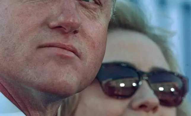FILE - President Clinton sits with first lady Hillary Clinton during a campaign rally in San Antonio, Nov. 2, 1996. (AP Photo/Greg Gibson, file)