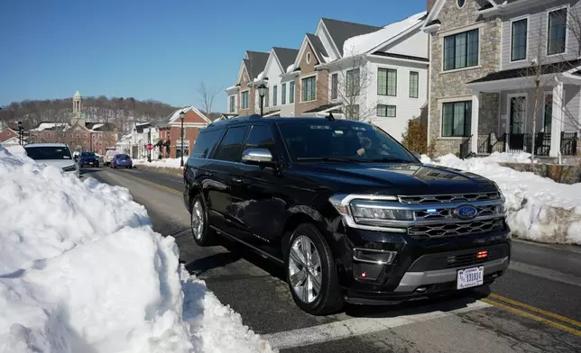 A motorcade carrying former President Bill Clinton approaches the Chappaqua Performing Arts Center where Clinton is scheduled to testify before U.S. House lawmakers as part of a congressional investigation into convicted sex offender Jeffrey Epstein, Friday, Feb. 27, 2026, in Chappaqua, N.Y. (AP Photo/Angelina Katsanis)