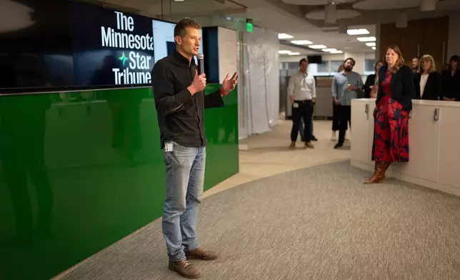 This undated photo shows Steve Grove, publisher and chief executive of the Star Tribune, speaking to the newsroom in Minneapolis. (Renee Jones Schneider/Star Tribune via AP)