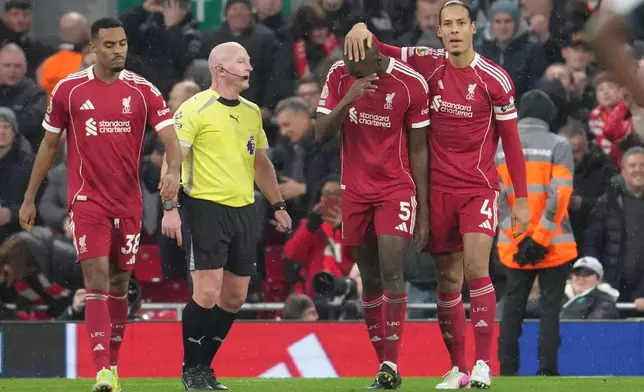 Liverpool's Ryan Gravenberch, left, Liverpool's Ibrahima Konate and Liverpool's Virgil van Dijk, right, celebrate after scoring their side's fourth goal during the English Premier League soccer match between Liverpool and Newcastle in Liverpool, England, Saturday, Jan. 31, 2026.(AP Photo/Jon Super)