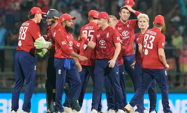 England's players celebrate after winning third T20 cricket match against Sri Lanka at Pallekele, Sri Lanka, Tuesday, Feb, 3. 2026. (AP Photo/Eranga Jayawardena)