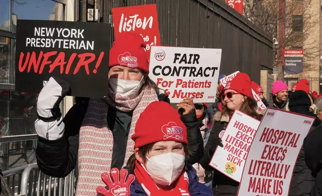 Striking nurses walk a picket line outside NewYork Presbyterian Hospital in New York, Monday, Feb. 9, 2026. (AP Photo/Richard Drew)