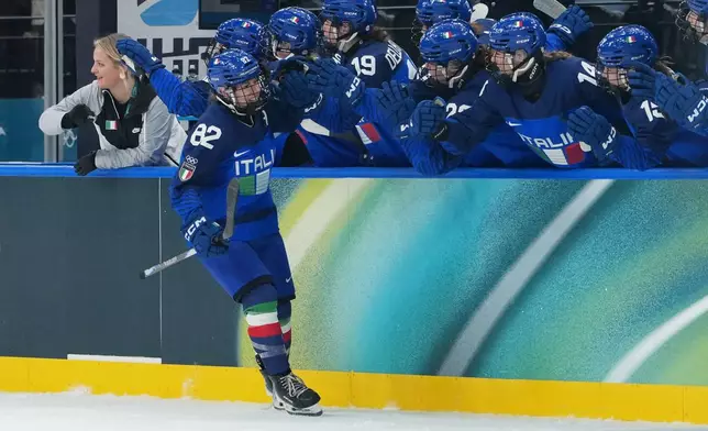 Italy's Kayla Tutino (82) celebrates after scoring a goal in the first period during a preliminary round match of women's ice hockey against France at the 2026 Winter Olympics, in Milan, Italy, Thursday, Feb. 5, 2026. (AP Photo/Carolyn Kaster)