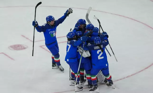 Italy's Franziska Stocker (18) skates to celebrate with teammates after winning a preliminary round match of women's ice hockey against France at the 2026 Winter Olympics, in Milan, Italy, Thursday, Feb. 5, 2026. (AP Photo/Carolyn Kaster)