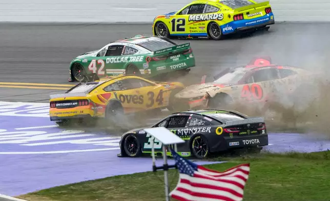 Riley Herbst, (35), Justin Allgaier, (40), Todd Gilliland, (34), John Hunter Nemechek, (42) and Ryan Blaney, (12) collide during the NASCAR Daytona 500 auto race at Daytona International Speedway, Sunday, Feb. 15, 2026, in Daytona Beach, Fla. (AP Photo/John Raoux)