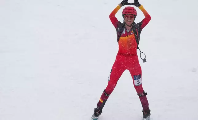 Spain's Ana Alonso Rodriguez celebrates taking third place in a ski mountaineering women's sprint final, at the 2026 Winter Olympics, in Bormio, Italy, Thursday, Feb. 19, 2026. (AP Photo/Rebecca Blackwell)