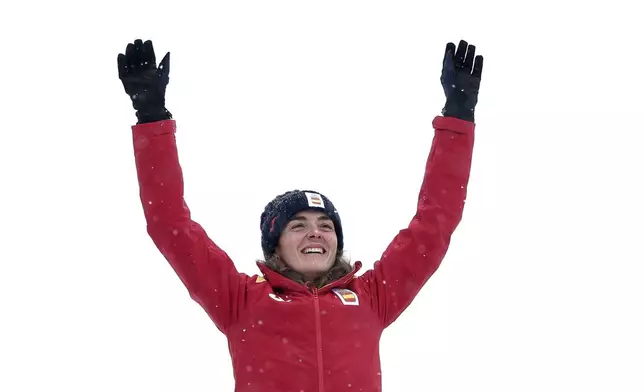 Spain's Ana Alonso Rodriguez celebrates after winning the bronze medal in a ski mountaineering women's sprint final, at the 2026 Winter Olympics, in Bormio, Italy, Thursday, Feb. 19, 2026. (AP Photo/Gabriele Facciotti)