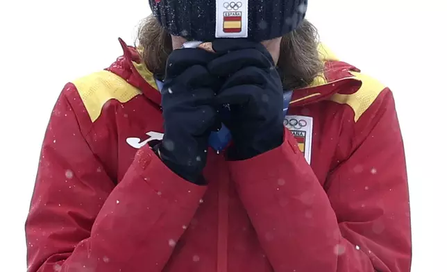Spain's Ana Alonso Rodriguez reacts after winning the bronze medal in a ski mountaineering women's sprint final, at the 2026 Winter Olympics, in Bormio, Italy, Thursday, Feb. 19, 2026. (AP Photo/Gabriele Facciotti)