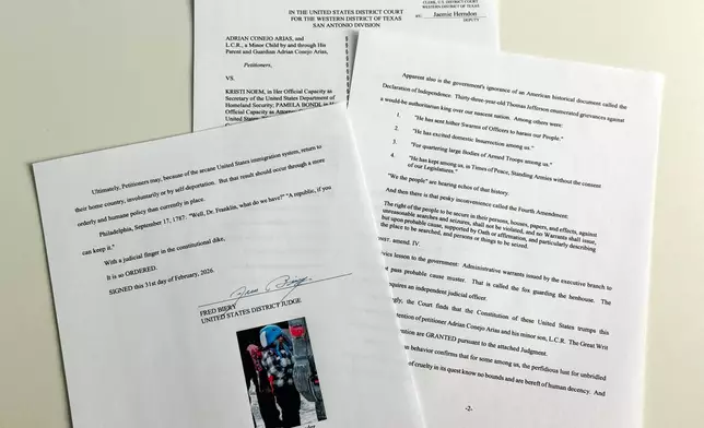 An order to release 5-year-old Liam Conejo Ramos and his father from detention, which included a picture of the boy and Bible verse references under the signature of U.S. District Judge Fred Biery, is photographed Saturday, Jan. 31, 2026. (AP Photo/Sydney Schaefer)