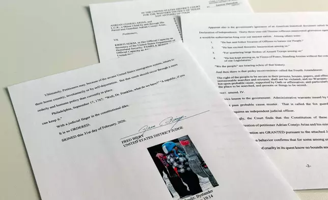 An order to release 5-year-old Liam Conejo Ramos and his father from detention, which included a picture of the boy and Bible verse references under the signature of U.S. District Judge Fred Biery, is photographed Saturday, Jan. 31, 2026. (AP Photo/Sydney Schaefer)