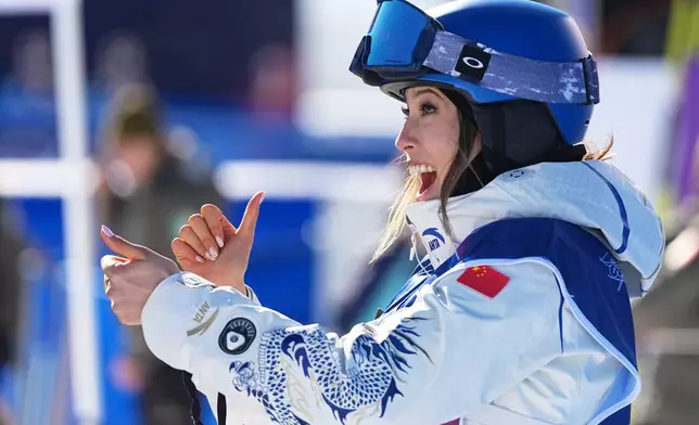 China's Eileen Gu celebrates competes during women's freestyle skiing slopestyle qualifications at the 2026 Winter Olympics, in Livigno, Italy, Saturday, Feb. 7, 2026. (AP Photo/Gregory Bull)