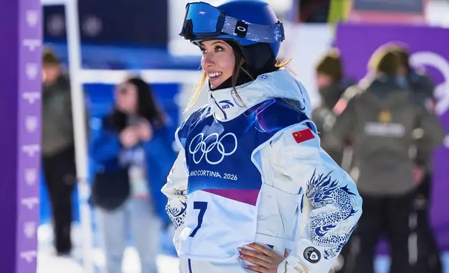 China's Eileen Gu looks on during women's freestyle skiing slopestyle qualifications at the 2026 Winter Olympics, in Livigno, Italy, Saturday, Feb. 7, 2026. (AP Photo/Gregory Bull)