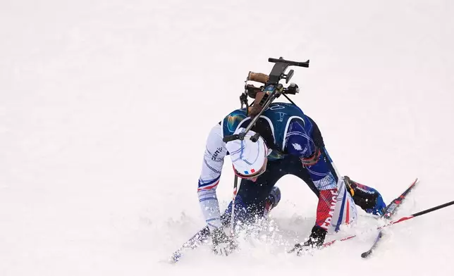 Eric Perrot, of France, reacts in the finish area after winning gold in the men's 4x7.5-kilometer relay biathlon race at the 2026 Winter Olympics in Anterselva, Italy, Tuesday, Feb. 17, 2026. (AP Photo/Andrew Medichini)