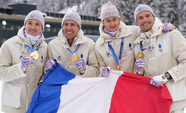 France's Eric Perrot, Quentin Fillon Maillet, Emilien Jacquelin and Fabien Claude pose with the gold medal for the men's 4x7.5-kilometer relay biathlon race at the 2026 Winter Olympics in Anterselva, Italy, Tuesday, Feb. 17, 2026. (AP Photo/Andrew Medichini)