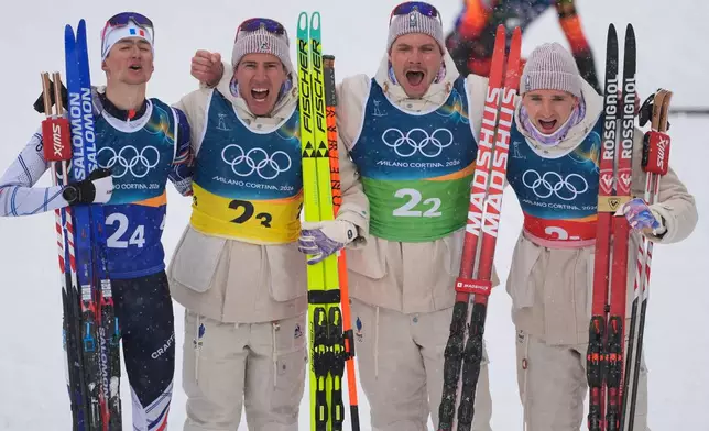 France's Eric Perrot, from left, Quentin Fillon Maillet, Emilien Jacquelin and Fabien Claude react after winning gold in the men's 4x7.5-kilometer relay biathlon race at the 2026 Winter Olympics in Anterselva, Italy, Tuesday, Feb. 17, 2026. (AP Photo/Andrew Medichini)