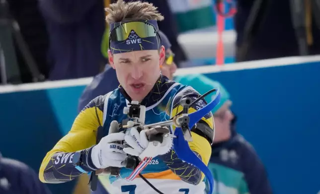 Martin Ponsiluoma of Sweden competes during the biathlon Men's 12.5km pursuit at the 2026 Winter Olympics, in Anterselva, Italy, Sunday, Feb. 15, 2026. (AP Photo/Christophe Ena)