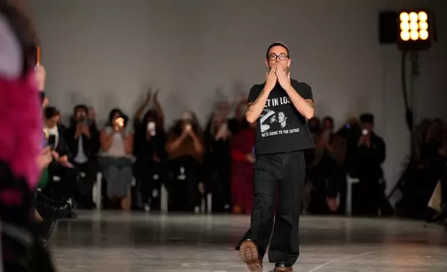 Designer Christian Siriano walks the runway at the end of his Fall/Winter 2026 fashion show as part of New York Fashion Week on Thursday, Feb. 12, 2026, in New York. (Photo by Charles Sykes/Invision/AP)