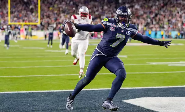 Seattle Seahawks linebacker Uchenna Nwosu (7) celebrates his touchdown on a fumble recovery during the second half of the NFL Super Bowl 60 football game against the New England Patriots, Sunday, Feb. 8, 2026, in Santa Clara, Calif. (AP Photo/Mark J. Terrill)