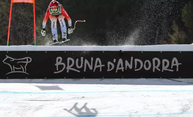 Switzerland's Corinne Suter arrives at the finish area of an alpine ski, women's World Cup downhill, in Soldeu, Andorra, Friday, February. 27, 2026. (AP Photo/Marco Trovati)
