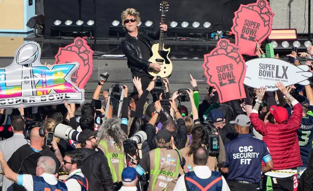 Billie Joe Armstrong of Green Day performs before the NFL Super Bowl 60 football game between the Seattle Seahawks and New England Patriots, Sunday, Feb. 8, 2026, in Santa Clara, Calif. (AP Photo/Charlie Riedel)