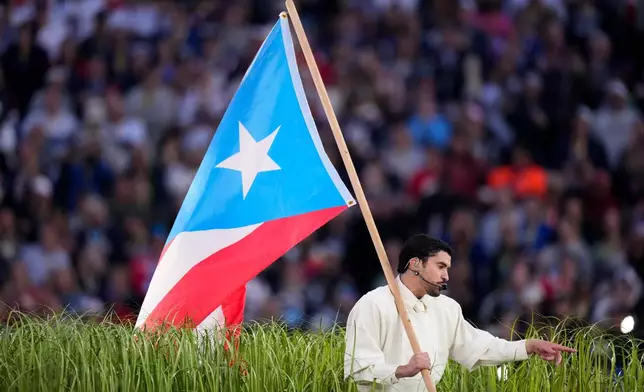 Bad Bunny performs during halftime of the NFL Super Bowl 60 football game between the New England Patriots and the Seattle Seahawks, Sunday, Feb. 8, 2026, in Santa Clara, Calif. (AP Photo/Mark J. Terrill)