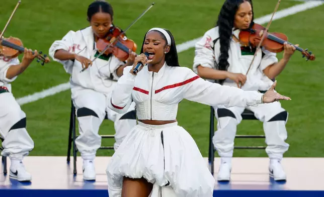 Grammy Award-winner Coco Jones performs "Lift Every Voice and Sing" during pregame festivities for Super Bowl LX between the Seattle Seahawks and the New England Patriots in Santa Clara, Calif., Sunday, Feb. 8, 2026. (Scott Strazzante/San Francisco Chronicle via AP)