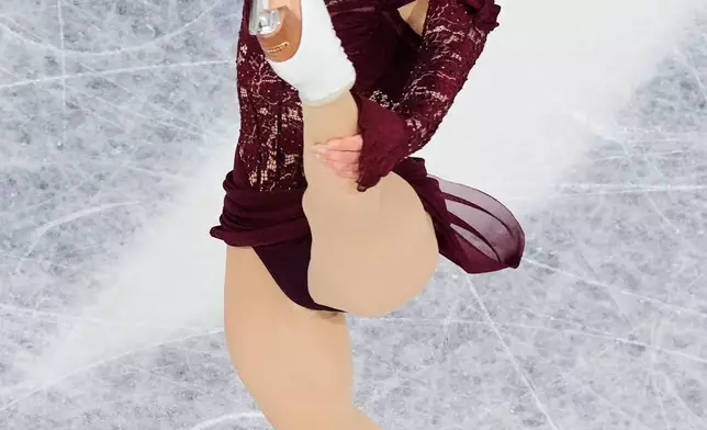 Amber Glenn of the United States competes during the women's short program figure skating at the 2026 Winter Olympics, in Milan, Italy, Tuesday, Feb. 17, 2026. (AP Photo/Bernat Armangue)