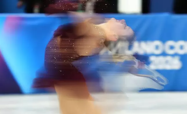 Amber Glenn of the United States competes during the women's short program figure skating at the 2026 Winter Olympics, in Milan, Italy, Tuesday, Feb. 17, 2026. (AP Photo/Francisco Seco)