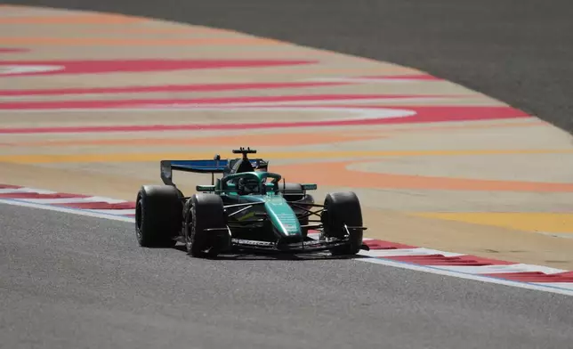 Aston Martin driver Lance Stroll of Canada steers his car during a Formula One pre-season test at the Bahrain International Circuit in Sakhir, Bahrain, Wednesday, Feb. 11, 2026. (AP Photo/Altaf Qadri)