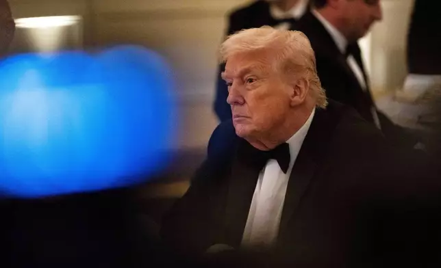 President Donald Trump attends the National Governors Association dinner at the White House, Saturday, Feb. 21, 2026, in Washington. (AP Photo/Allison Robbert)