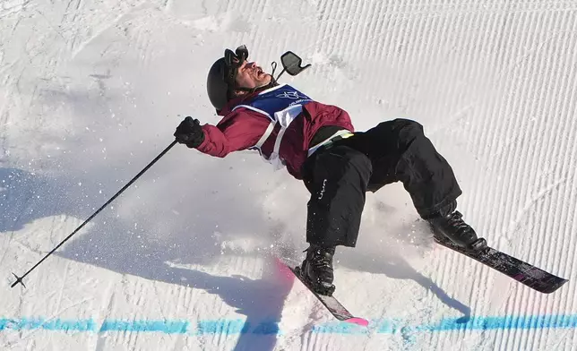 Austria's Julius Forer crashes during men's freestyle skiing slopestyle qualifications at the 2026 Winter Olympics, in Livigno, Italy, Saturday, Feb. 7, 2026. (AP Photo/Lindsey Wasson)