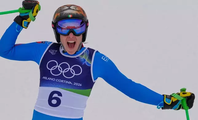 Italy's Federica Brignone reacts in the finish area, during an alpine ski, women's super-G race, at the 2026 Winter Olympics, in Cortina d'Ampezzo, Italy, Thursday, Feb. 12, 2026. (AP Photo/Andy Wong)