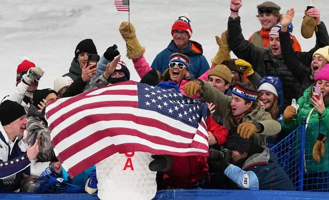 Gold medalist United States' Alex Ferreira celebrates in the stands after the men's freestyle skiing halfpipe finals at the 2026 Winter Olympics, in Livigno, Italy, Friday, Feb. 20, 2026. (AP Photo/Gregory Bull)