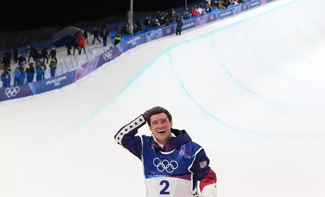 Gold medalist United States' Alex Ferreira celebrates winning the men's freestyle skiing halfpipe finals at the 2026 Winter Olympics, in Livigno, Italy, Friday, Feb. 20, 2026. (AP Photo/Abbie Parr)