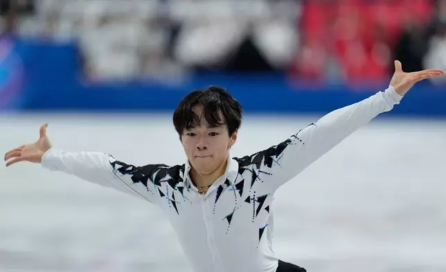 Yuma Kagiyama of Japan competes during the figure skating men's team event at the 2026 Winter Olympics, in Milan, Italy, Saturday, Feb. 7, 2026. (AP Photo/Natacha Pisarenko)