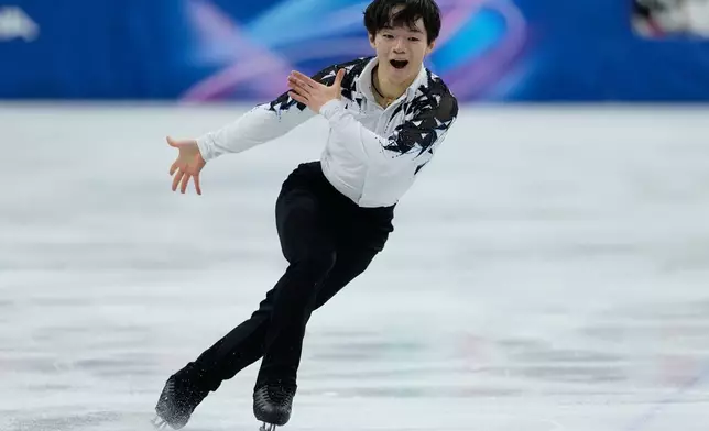 Yuma Kagiyama of Japan competes during the figure skating men's team event at the 2026 Winter Olympics, in Milan, Italy, Saturday, Feb. 7, 2026. (AP Photo/Natacha Pisarenko)