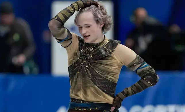 Ilia Malinin of the United States competes during the figure skating men's team event at the 2026 Winter Olympics, in Milan, Italy, Saturday, Feb. 7, 2026. (AP Photo/Natacha Pisarenko)
