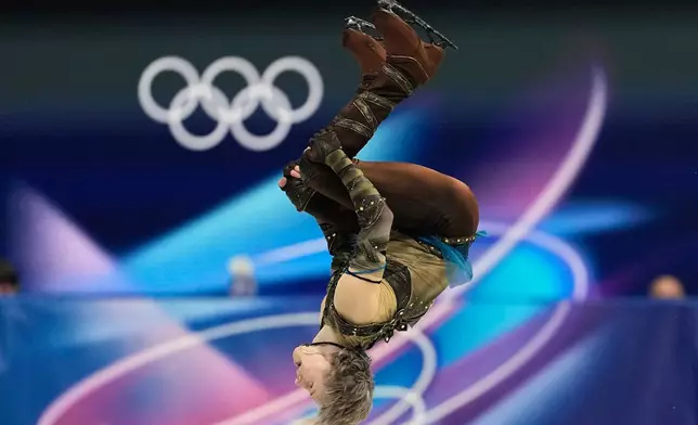 Ilia Malinin of the United States competes during the figure skating men's team event at the 2026 Winter Olympics, in Milan, Italy, Saturday, Feb. 7, 2026. (AP Photo/Natacha Pisarenko)