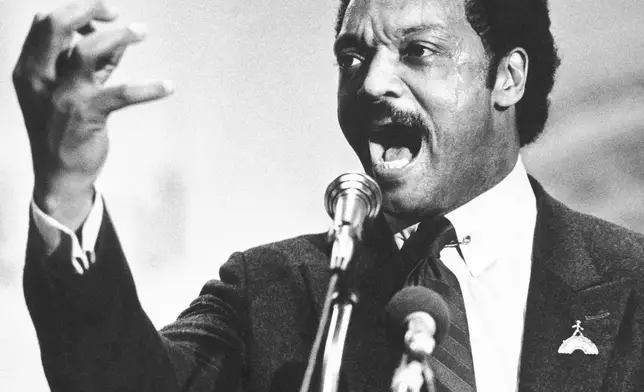 FILE - Democratic presidential primary candidate Jesse Jackson speaks to a group of his supporters at a rally held at a Baptist Church in Dayton, Ohio, April 14, 1984. (AP Photo/Rob Burns, File)