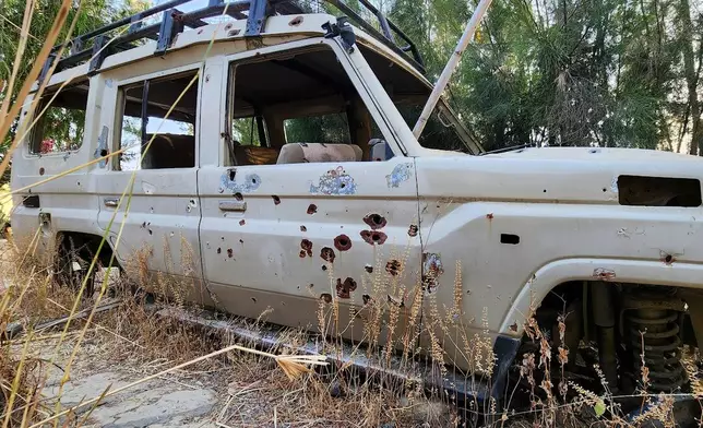 A bullet-riddled vehicle sits abandoned on the grounds of Wukro Lodge, once occupied by Eritrean troops, in the Tigray region of northern Ethiopia, on Jan. 26, 2026. (AP Photo/Jody Ray)