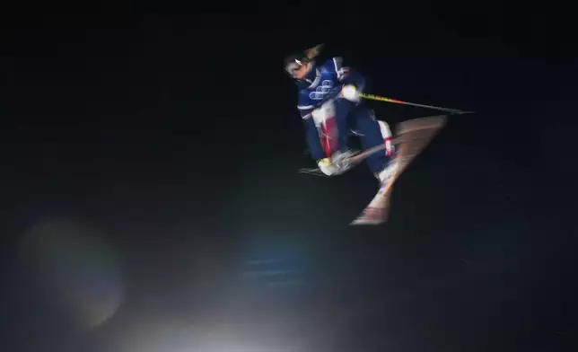 France's Kim Dumont Zanella competes in the women's freestyle skiing big air qualifications at the 2026 Winter Olympics, in Livigno, Italy, Saturday, Feb. 14, 2026. (AP Photo/Lindsey Wasson)