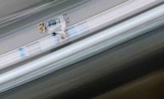 Domen Prevc, of Slovenia, goes down the ramp during a ski jumping, men's normal hill, training session, at the 2026 Winter Olympics, in Predazzo, Italy, Sunday, Feb. 8, 2026. (AP Photo/Matthias Schrader)