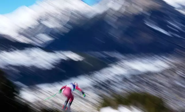 Canada's Cameron Alexander speeds down the course during an alpine ski, men's downhill race, at the 2026 Winter Olympics, in Bormio, Italy, Saturday, Feb. 7, 2026. (AP Photo/Julia Demaree Nikhinson)
