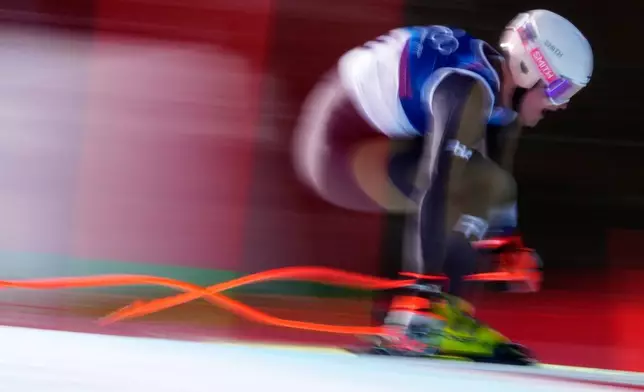 Finland's Elian Lehto speeds down the course during an alpine ski, men's downhill race, at the 2026 Winter Olympics, in Bormio, Italy, Saturday, Feb. 7, 2026. (AP Photo/Julia Demaree Nikhinson)