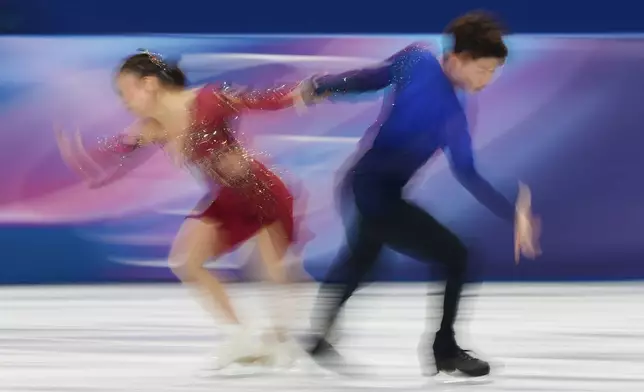 Utana Yoshida and Masaya Morita of Japan compete during the figure skating ice dance team event at the 2026 Winter Olympics, in Milan, Italy, Saturday, Feb. 7, 2026. (AP Photo/Francisco Seco)
